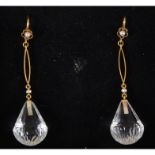A pair of crystal drop earrings, the pear shaped drops, faceted lower half,