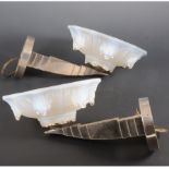 A pair of French Art Deco wall uplights, probably by Ezan, opalescent glass shades,