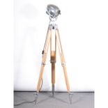 A Strand Electric theatre spot light, on tripod adjustable stand, chrome mounts, height 180cm.