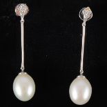 A pair of pearl drop earrings, the 9mm x 11mm pearls,