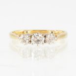 A diamond three stone ring, the old brilliant cut diamonds, slightly graduated in size,