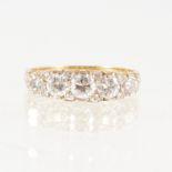 A diamond five stone half hoop ring,