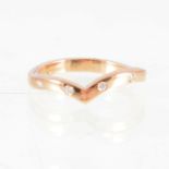 Cathy Stephens - A diamond set wishbone ring, the 18 carat rose gold 2.