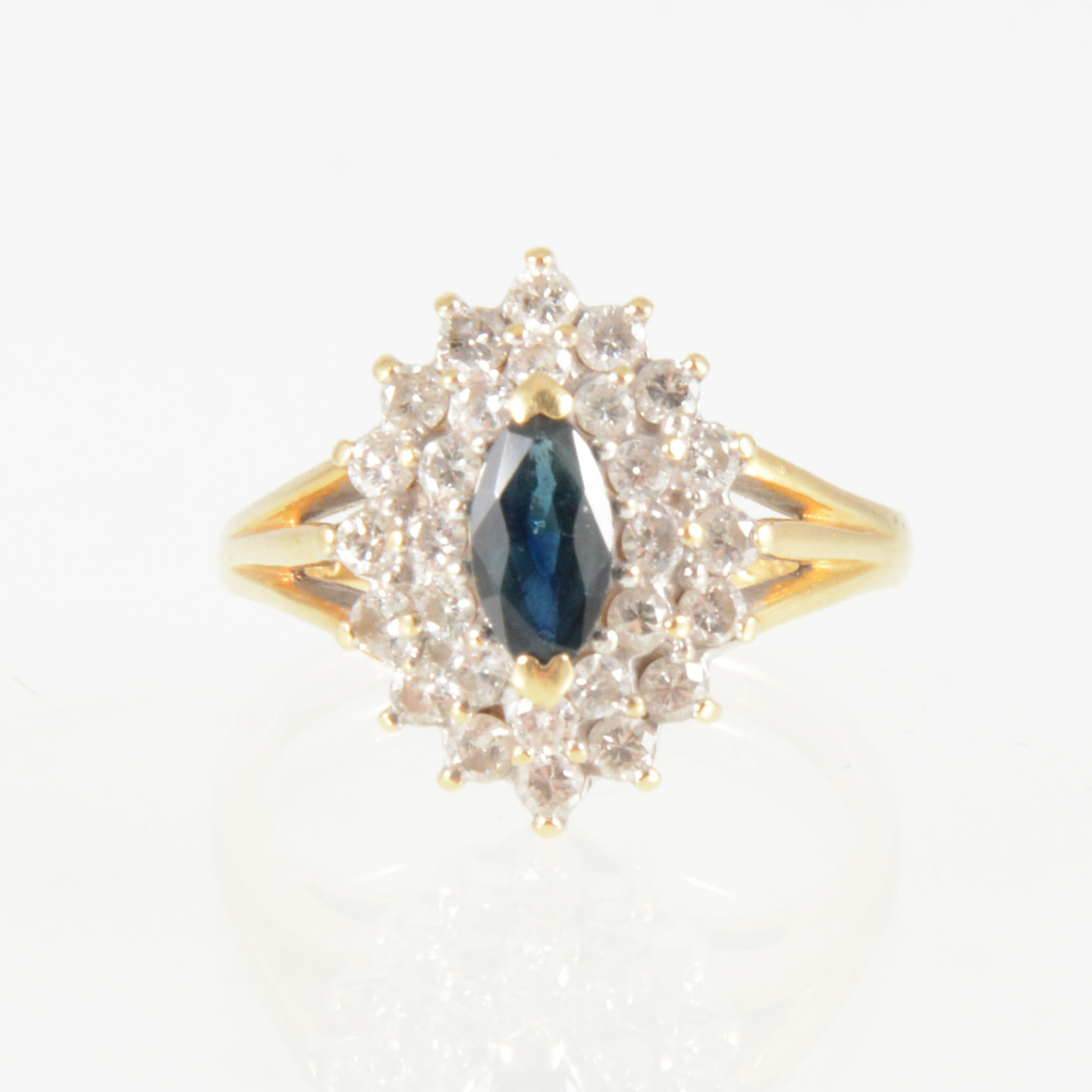 A sapphire and diamond marquise shaped cluster ring,