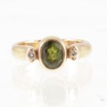 Tom Payne - A tourmaline and diamond three stone ring,