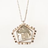 Tom Payne and Peter Triggs - A silver pentagonal pendant and chain with a natural specimen of iron