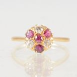 A ruby and diamond circular cluster ring,