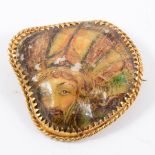A painted mother-of-pearl brooch,