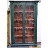 Large painted bookcase, inverted breakfront moulded cornice, above a key frieze,