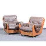 Pair of teak framed and leatherette armchairs, "Saddleboy", width 80cm.