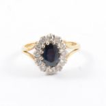 A sapphire and diamond oval cluster ring,