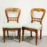 Matching set of twelve Victorian walnut balloon back chairs, carved decoration, spindle cross-rails,