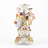 Dresden porcelain candlestick, the column modelled with lady and gentleman in 18th Century dress,