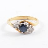 A sapphire and diamond three stone ring,