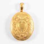 A Victorian yellow metal oval locket,
