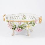 Dresden porcelain bowl, moulded and pierced borders encrusted with flowers on four scrolled feet,
