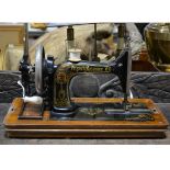 A Frister & Rossman maual portable sewing machine, number 3807002,