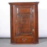 George III oak hanging corner cupboard, adapted, moulded cornice,