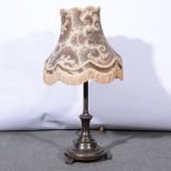 A patinated metal table lamp