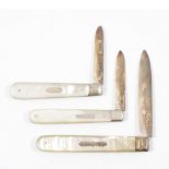 Three mother-of-pearl fruit knives with silver...