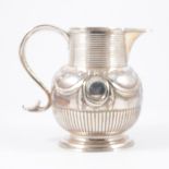 A silver jug, cancelled marks, London Assay...