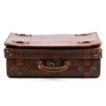 A vinatge leather expanding suitcase,...