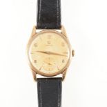 Omega - a gentleman's 9 carat yellow gold...