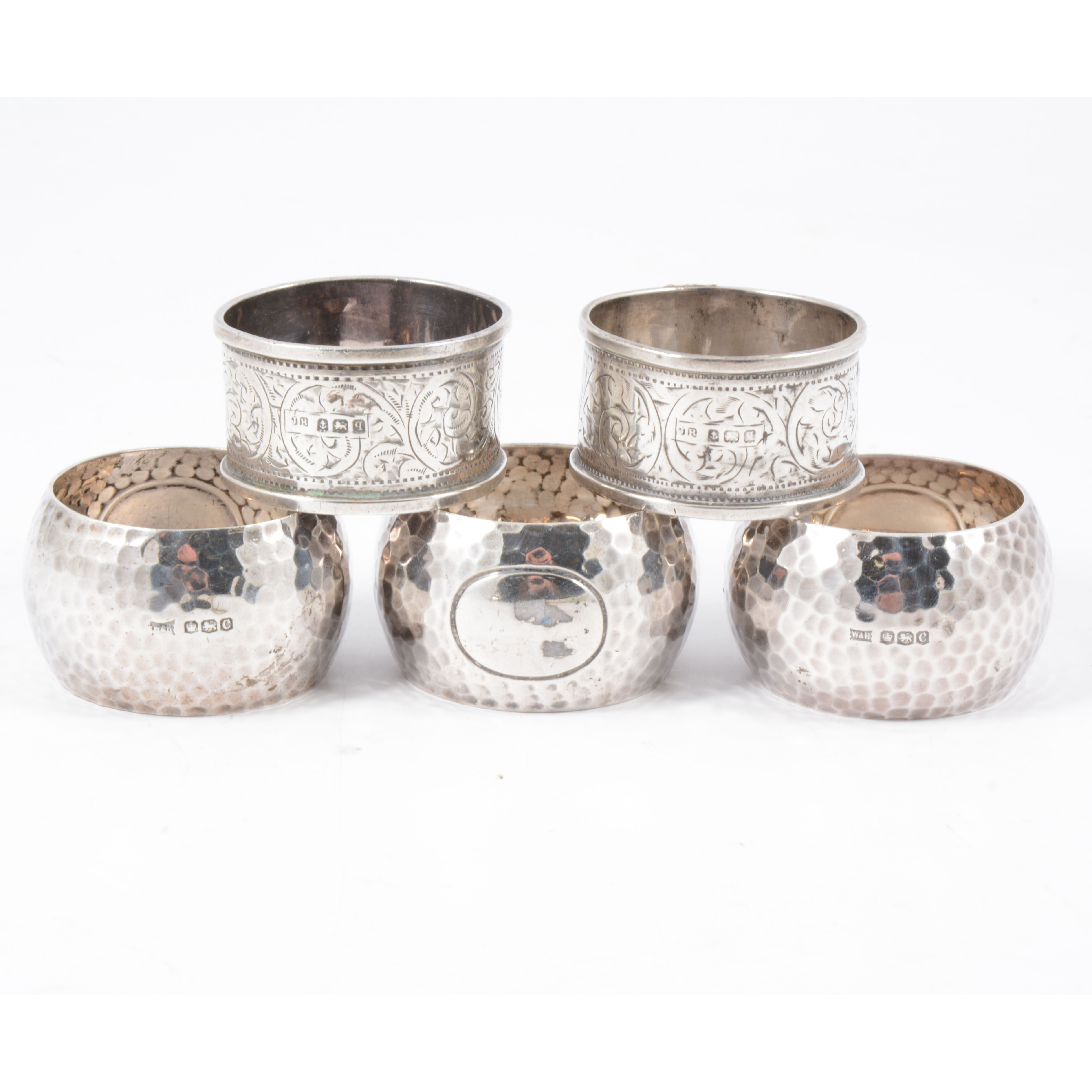 Five silver napkin rings, three 30mm wide D...