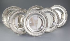 A rare and good set of six George IV silver soup plates, by Paul Storr, hallmarked London 1833/34,