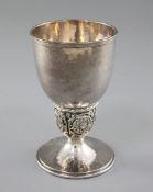 A 1930's Arts & Crafts silver goblet, by Omar Ramsden, hallmarked London 1938, with tapering spot