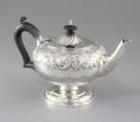 A Victorian silver teapot, by John Newton Mappin, hallmarked London 1897, of pedestal circular
