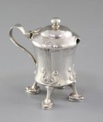 An Edwardian Arts and Crafts Cymric silver mustard pot, designed by Archibald Knox, for Liberty &