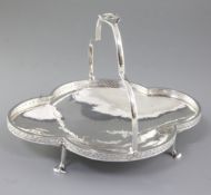 A George V Arts & Crafts silver shallow basket, by Albert Edward Jones, hallmarked Birmingham, 1923,