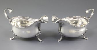 A pair of 1930's silver sauceboats, by Cooper Brothers & Sons Ltd, hallmarked for Sheffield 1936,