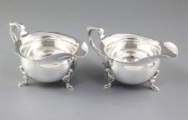 A pair of 1940's silver sauce boats, hallmarked Sheffield 1944, Roberts & Belk, of traditional