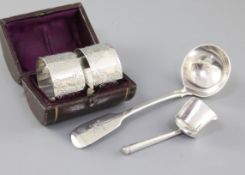 A George III silver caddy spoon, by Wardell & Kempson, of shovel form, with cannon shape handle,