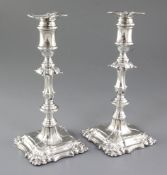 A pair of Edwardian silver candlesticks, hallmarked for Birmingham 1902, maker I.S.Greenberg (Israel