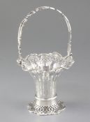 A George V silver swing handled trumpet shaped basket, hallmarked Birmingham 1919, maker Synyer &