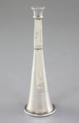 A Victorian novelty silver "hunting horn" pepperette, hallmarked London 1888 and made by WS over EM,