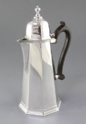 A George V early 18th century style silver hot water pot, by Goldsmiths & Silversmiths Co Ltd,