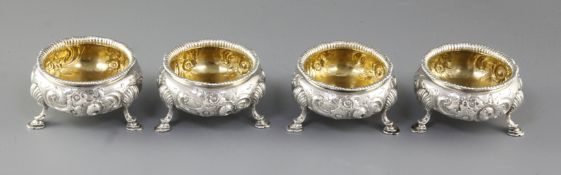 A set of four Victorian embossed silver table salts, by Roberts & Briggs, hallmarked for London