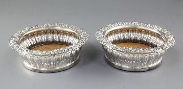 A pair of George IV silver wine coasters, by John & Thomas Settle, hallmarked Sheffield 1825, with