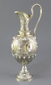 A mid Victorian parcel gilt silver ovoid shaped wine ewer/ claret jug, by Sibray, Hall & Co,