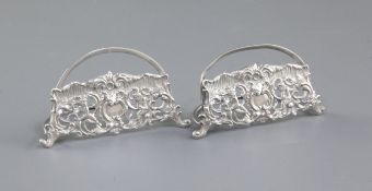 A pair of Edwardian silver semi circular menu holders, by William Comyns, hallmarked for London 1901