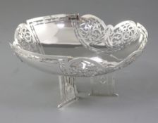 A George V pierced silver fruit bowl, by Walker & Hall, hallmarked Sheffield 1923, the circular bowl