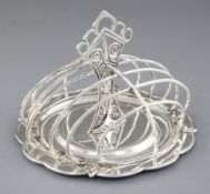 A good George V Arts & Crafts silver seven bar toast rack, by Henry George Murphy, hallmarked London