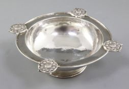 A George V Arts & Crafts silver raised circular dish, by Omar Ramsden, hallmarked London 1928, of