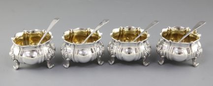 A set of four William IV silver salts, by Charles Goodwin, London, 1835, of lobed circular form,