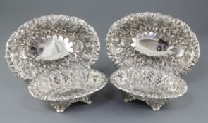A matched set of four Victorian embossed silver dishes (two pairs), by Horace Woodward & Co/ Ltd,