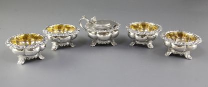 A set of four George III provincial silver table salts and matching mustard pot, hallmarked